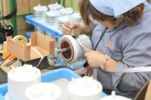 A technician assembling YOGURTiA at TANICA’s factory